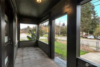 Covered front porch, new front doorway and lighting.