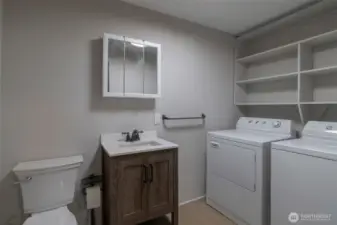 Laundry room with half bath off kitchen