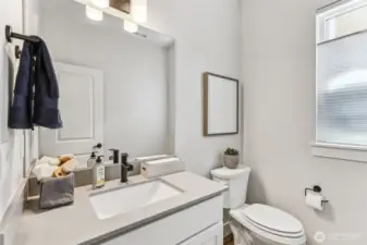 Pic is of model- 1/2 bath w/quartz counter on main level.