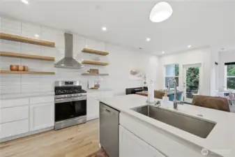 Delightful kitchen with floating shelf accents and quarts counters