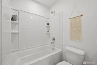 Not pictured as a large linen closet behind the door to this bathroom