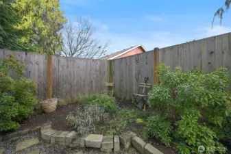 Raised corner bed for herbs or flowers
