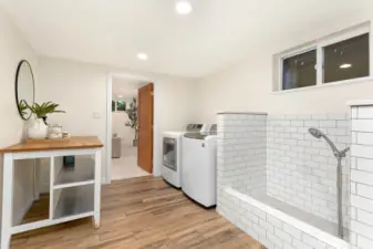 Dreamy laundry room with a dog wash station!