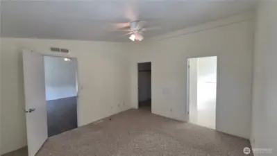 Main bedroom with walk-in closet and attached 3/4 bath.
