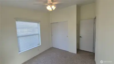 2nd bedroom with closet and built in shelves.