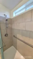 Main bath tiled walk-in shower.