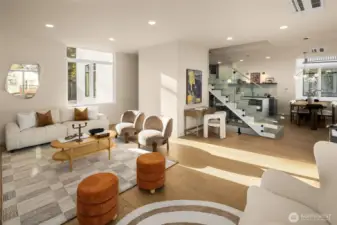 Seamless transitions between the living, dining, and kitchen areas emphasize the home's spacious footprint.