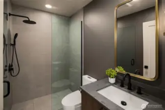 The secondary bathroom retains the luxury finish and feel found throughout the rest of the home