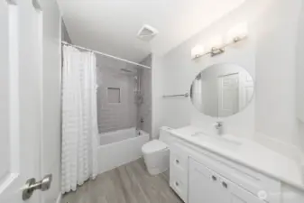 Refined full guest bathroom with clean finishes (upstairs).