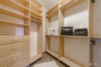 Shelving and drawers in your walk-in closet around the corner from the washer and dryer.