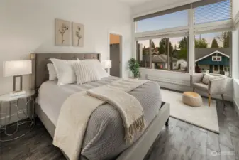 Bedroom #2 on the upper level features large corner windows with custom blinds and blackout shades and a large walk-in closet.