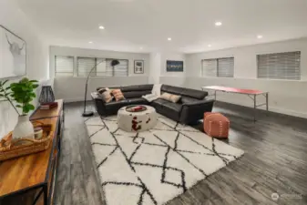 Lower level family room has tall ceilings and ample light from north and west facing windows. Radiant heated floors keeps the room cozy on those cold days, while ductless A/C (not pictured) keeps the room cool on hot days.