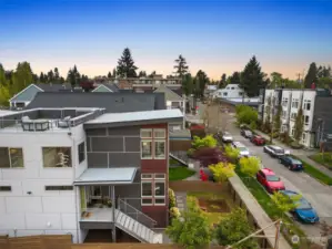 This aerial shot facing north shows the rooftop deck and some of the beautiful architectural details of the home.