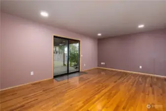 Family Room w/ covered deck through glass sliding doors