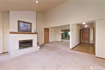 Looking back from the living room towards the dining room, family room, and entry.