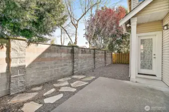 Private fully-fenced side yard with patio. Perfect for your fur babies!