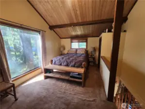 Primary has a large window overlooking the back yard