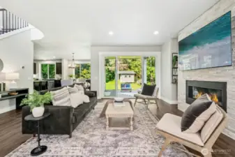 Living room with fireplace & patio access