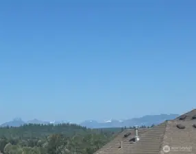 June 7 view from an iphone camera from the deck and E windows looking to the Cascade mountains with SNOW