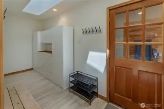 Mud room with updated flooring located off of the breezeway. This could be converted to a future laundry room.