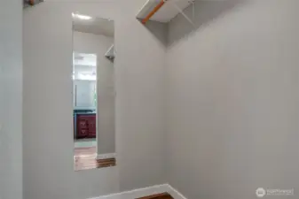 Spacious walk-in primary bedroom closet.
