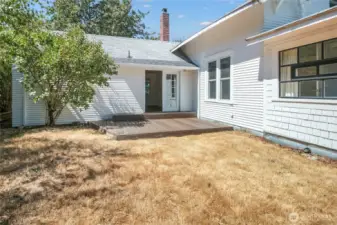 French doors from the primary bedroom open on to one of two backyard decks.