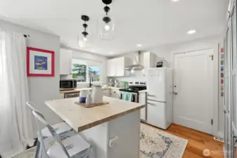 Open Kitchen with lots of light, butcher block kitchen island and new everything!