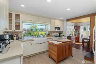 Gorgeous cabinets and custom tile backsplash add so much character