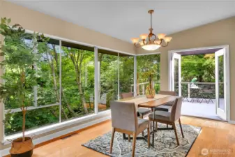 Dining area with French doors to entertainment size deck and access to another Bluestone patio.