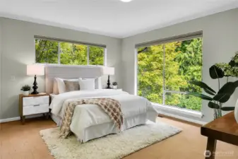 Primary bedroom with the natural light and view of nature's paradise.