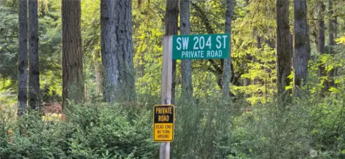 Southwest corner of the lot at the corner of SW 204th Street and Westside Hwy. The lot is 300 feet wide x 300 feet deep (perfect square that is 2.07 acres). Gorgeous fully wooded lot that provides privacy and natural beauty.