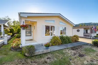 A paved sidewalk from your private driveway leads to the covered entry.