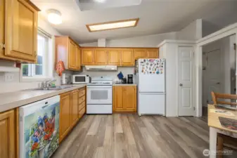 Spacious kitchen has a pantry, newer appliances, and breakfast nook.