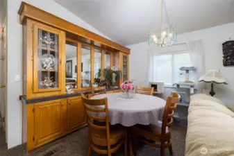 The formal dining area features a built-in china hutch.