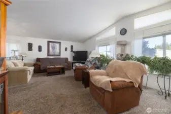 Nice open living area with high ceilings and lots of natural light.