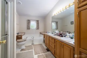 The primary ensuite, with two sinks, lots of storage, a soaking tub and separate step-in shower.