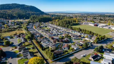 Anther view of the park, with Little Mountain (home to miles of trails and great views) is at the top left.  Skagit Bay and the Olympics at the back right.  To the right of the park is the playfield for local schools.