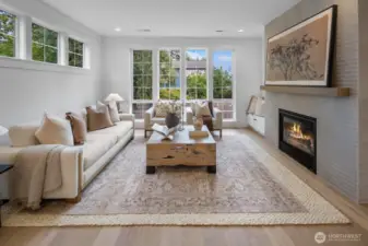 Sun-drenched living room with walls of windows, built-in seating, and thoughtful layout. Perfect balance of comfort and style, ideal for both entertaining and everyday living.