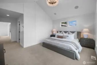 Spacious primary suite with vaulted ceilings and modern architectural details. Thoughtfully designed for comfort and relaxation.