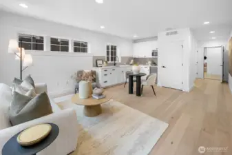 Lower level retreat with full kitchenette, wide-plank flooring, and flexible living space. Perfect for guests, recreation, or multi-generational living.