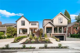 Striking modern design with clean architectural lines, stone detail, and manicured landscaping. A standout presence in the neighborhood.
