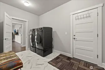 Convenient laundry room on the main floor with a water line pre-installed for future utility sink.