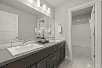 Full bathroom with double vanity upstairs adjacent to bedrooms.