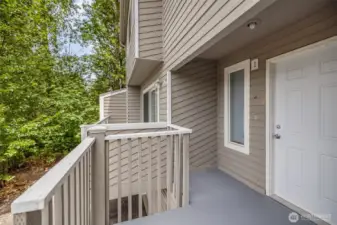 Inviting cozy front patio welcomes you in.