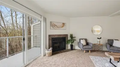 Cozy fireplace in the living room with lots of natural light from your private balcony.