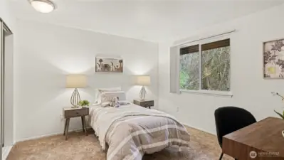 Spacious second bedroom next to upstairs bath.