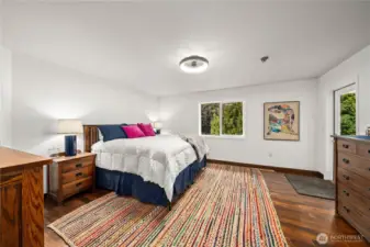 Large primary bedroom with direct backyard access.