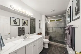 Remodeled guest bathroom with tile surround, walk-in shower!