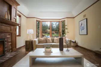 Grand fireplace mantel and gas fireplace in living room