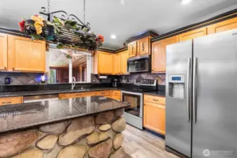 The central island offers additional prep space and a natural spot to gather,